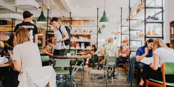 people eating inside of cafeteria during daytime